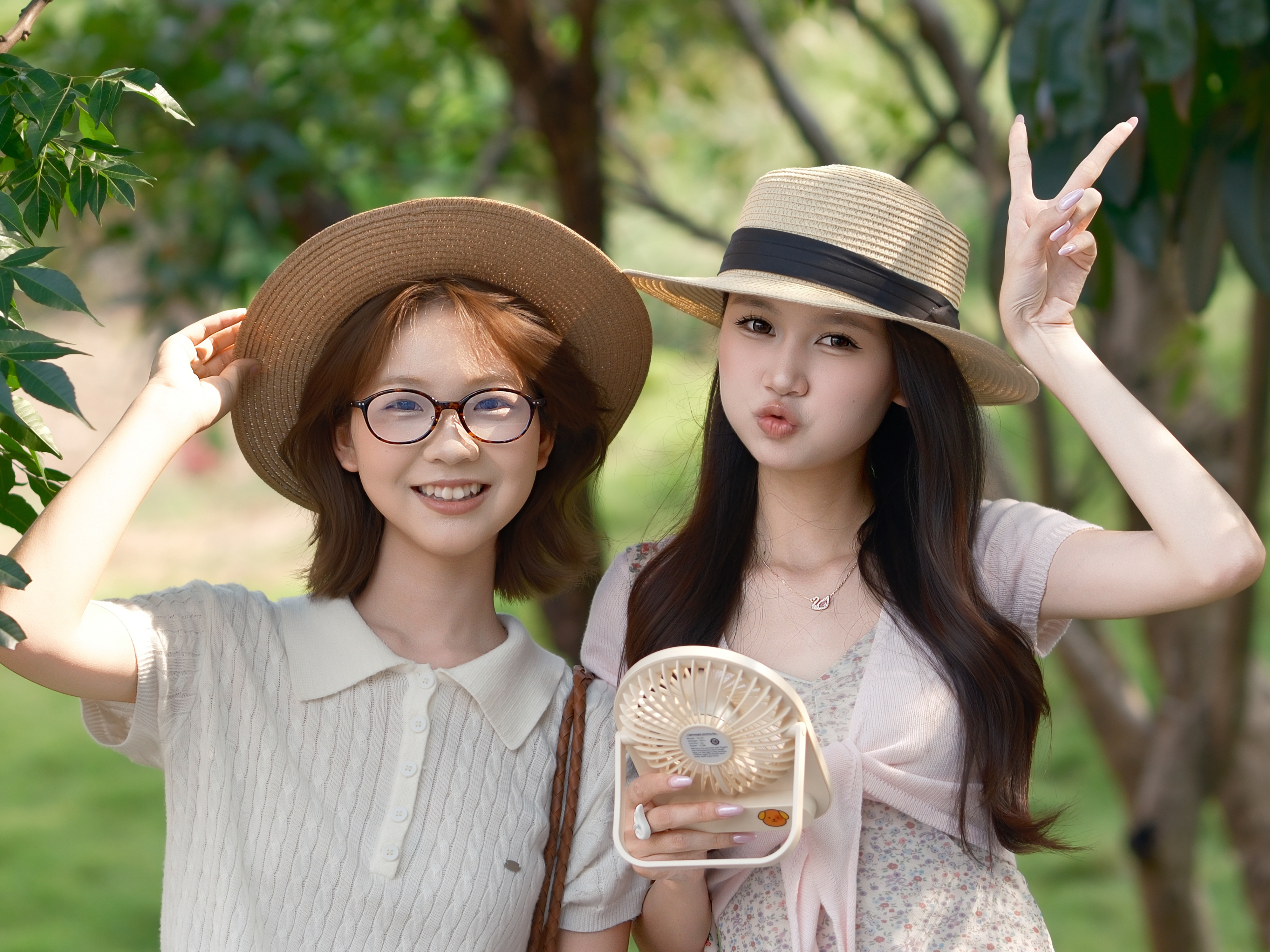 Two people in hats, outdoor portrait